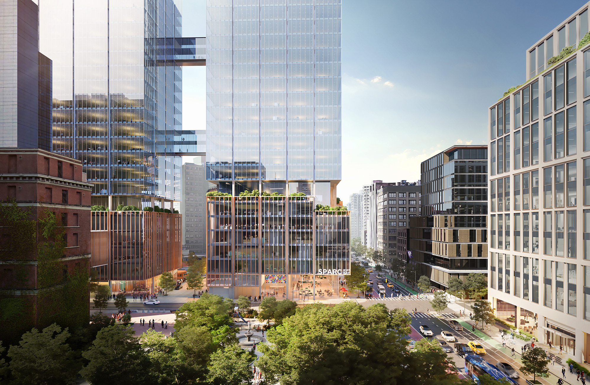Aerial rendering of SPARC Kips Bay. A modern New York City scape with tall glass skyscrapers reflecting sunlight. The buildings are surrounded by trees and busy streets filled with cars and people. Balconies with greenery are visible. The word SPARC is on one of the buildings.
