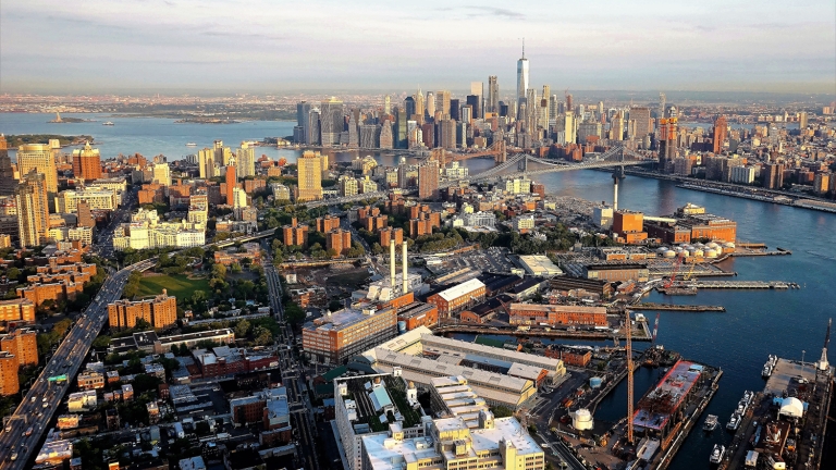 Aerial view of Brooklyn with the Navy Yard in foreground The East River and Manhattan is visible in distance